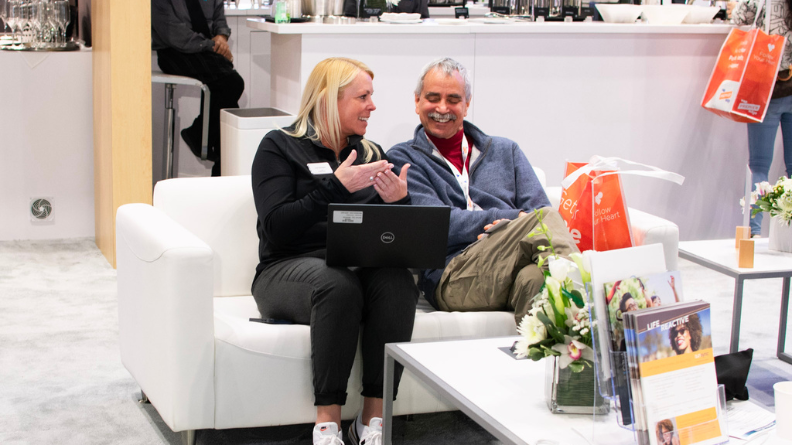 Eyefinity account executive speaking with a doctor at Vision Expo East