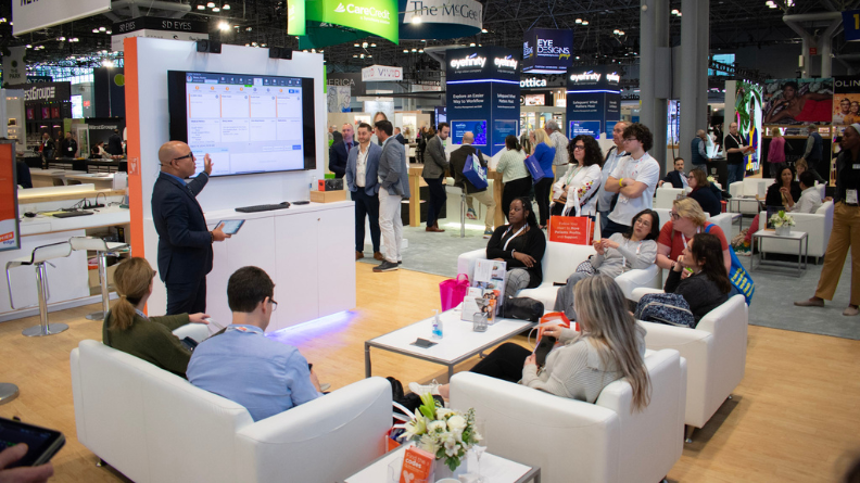 Phernell Walker presenting to ECPs in the Eyefinity Vision Expo East booth.