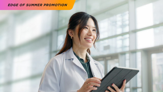 Picture of woman holding tablet using software for optometrists 