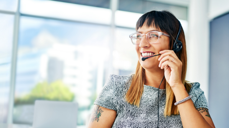 Woman smiling with a headset on