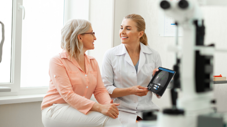 Doctor and patient looking at diagnostic image on tablet