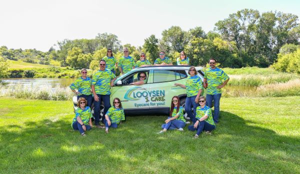 Looysen I Care staff in front of car